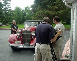 1933 Cadillac V-16 Convertible Coupe body by Fisher DSC00842 Dick Shappy with his just- completed 1933 V-16 convertible coupe being interviewed by David Robichaud from the channel UPN 38 TV program, "Robi on the Road"....