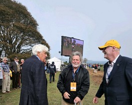 2023 Audrain Motor Week 1 Jay Leno and Richard Hunter congratulating Dick Shappy as he walks to the podium to receive his award