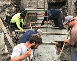 New Showroom Provicence 2017 IMG_5559 Coarse grading (in the foreground) is followed by manual troweling.