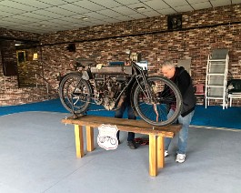 New Showroom 2022 2022-02-05 5852 Workers centering the Curtiss twin onto the display table.