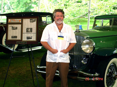 Dick Shappy posing with his Duesenberg Derham J-505
