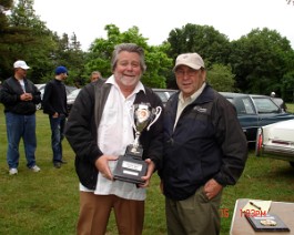 DSC03995 Dick Shappy accepting the "Best of Show" trophy from Cadillac LaSalle Club New England Region official Richard Esposito.