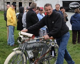 DSC_8127 Nick Pitcu delivers Dick Shappy's 1914 Pope motorcycle to the judging stand to receive "Best Motorcycle" award May 23, 2011. Concourse d'Elegance at Fort Adams...