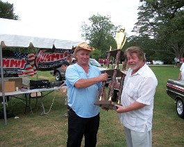 100_0950 Dick Shappy accepting "Best of the Best" trophy from event boss Gene Pezulli at Autos of the World show East Greenwich, Rhode Island July 25, 2010.