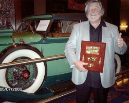 car show 038 Dick Shappy holding "Best Early American Classic" award for his 1934 Duesenberg J-505 Convertible Sedan, Body by Derham, Mohegan Sun Casino, Ledyard,...