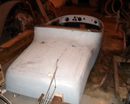 Completed roadster body with complete new wood exterior primed and ready for paint.