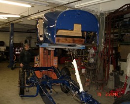 Body being lowered onto the completed chassis.