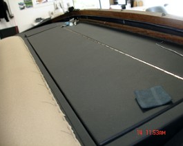Package tray construction and leather covering completed.