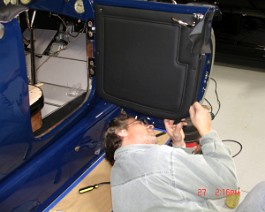 Nick, the upholsterer putting final touches on right door panel.