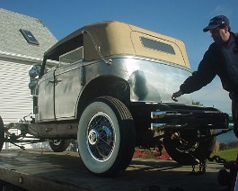 1934 Duesenberg Model J-505 Convertible Sedan Body by Derham DSC00418 Fenders, hood, and other body parts have been removed, and the car is being moved to the paint shop.